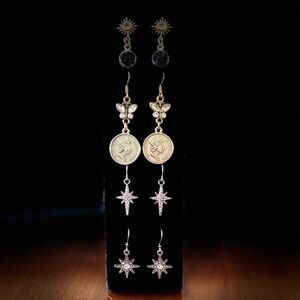 Silver “North star” earrings with rhinestone embellishments